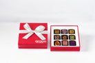 Diwali Collection, open red gift box with nine chocolates from this collection